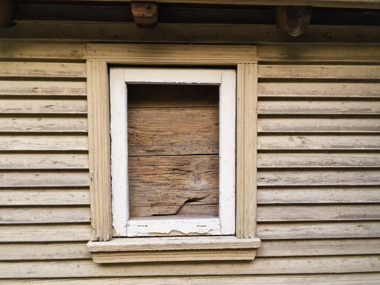 A worn window being assessed for repair or replacement