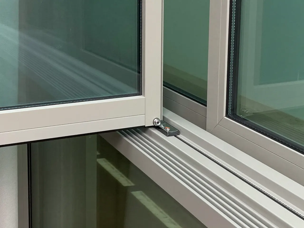 Edge detail of sealed double glazing showing the insulating spacer bar